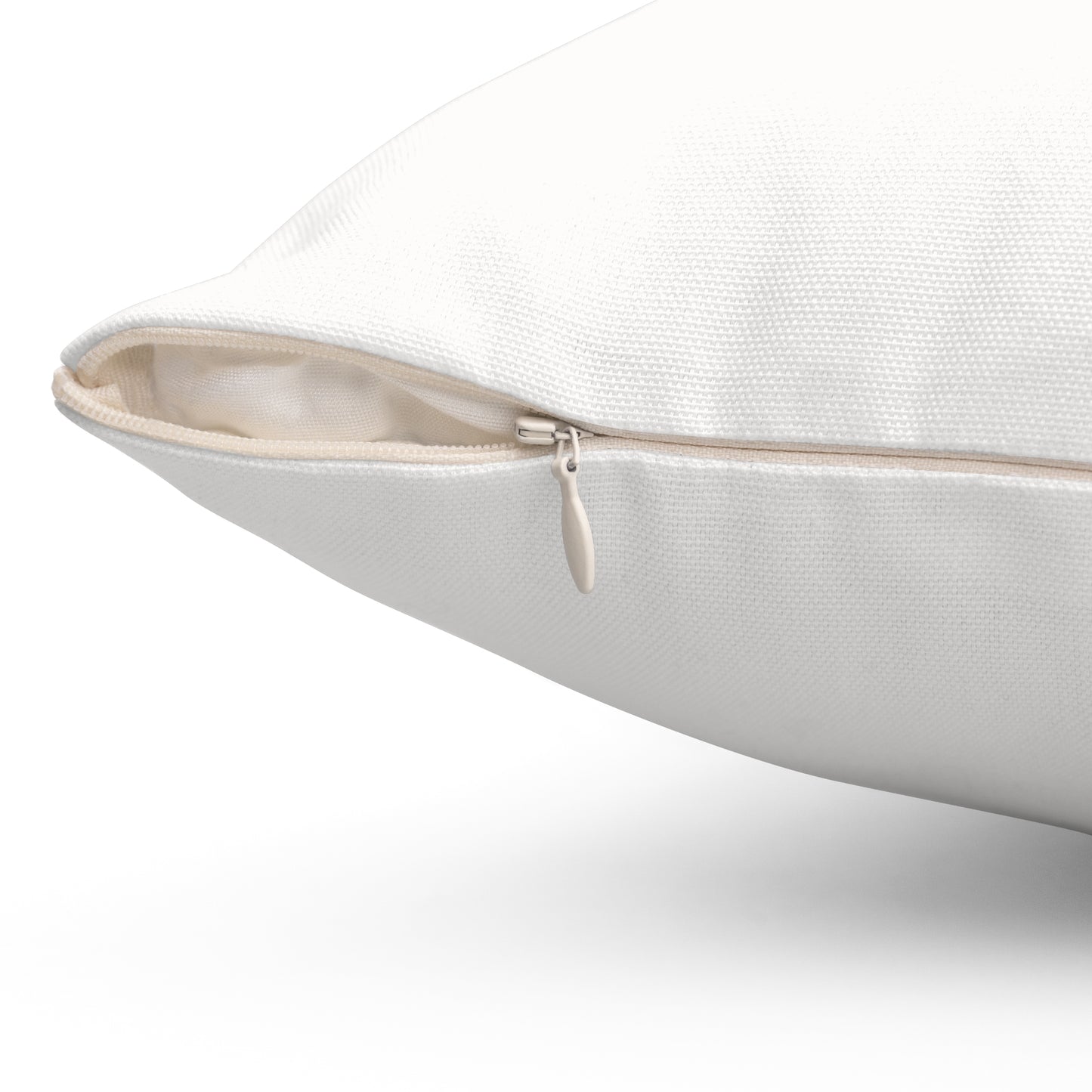 Close-up view of concealed zipper on white decorative pillow