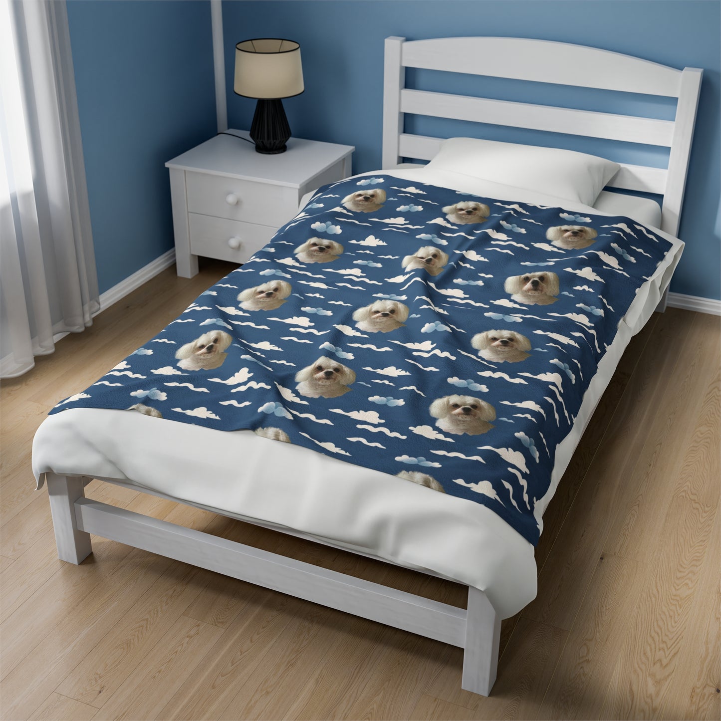 Personalized blue velveteen plush blanket with custom dog photo and soft cloud design on bed
