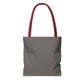 Dark grey tote bag with red handles, back view